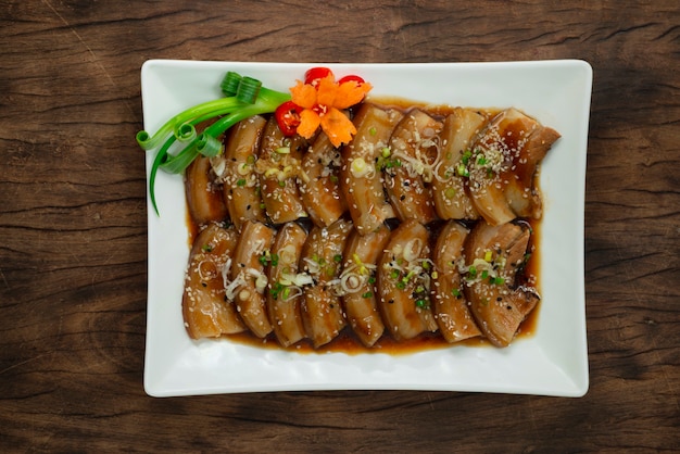 Chashu Pork Belly boiled in  Soy Sauce sprinkle sesame and Leek onion