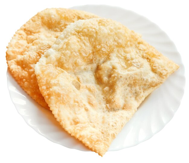 Cheburek pie on white plate isolated