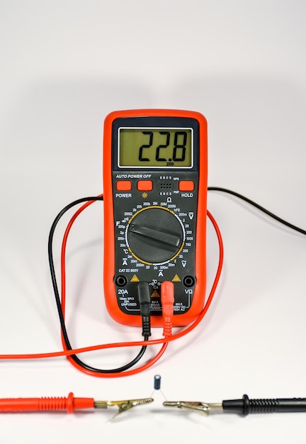 Check the capacitor with a multimeter