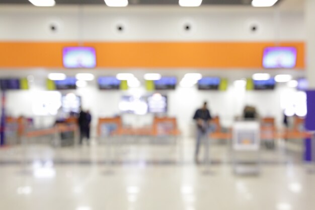 焦点が合っていない空港のチェックインカウンター-ボケ味の背景