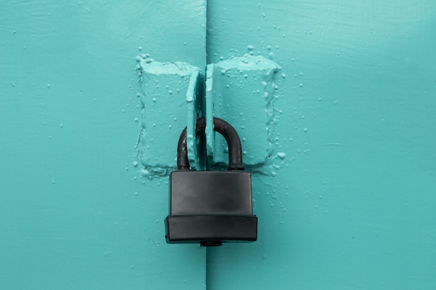 Check-lock on the brown wooden table background