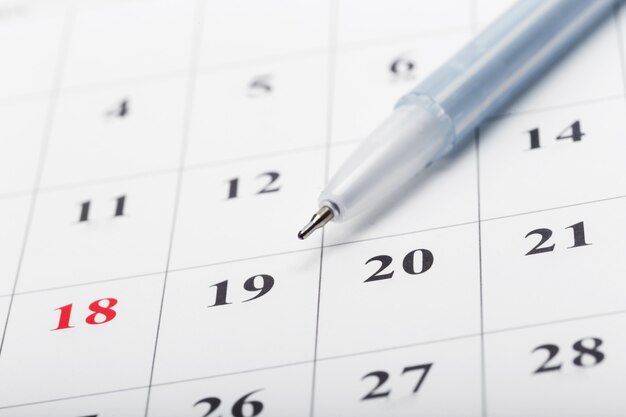 Check out the dates in a business calendar concept