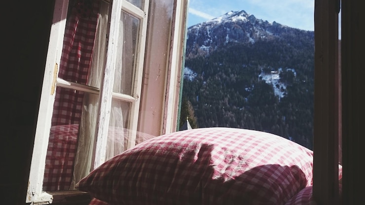 Photo checked pattern cushion on window sill