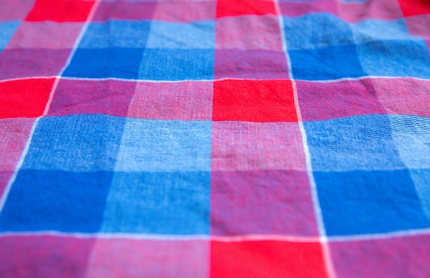 Checkered cloth texture. Squares on textile. Natural fabrics background.