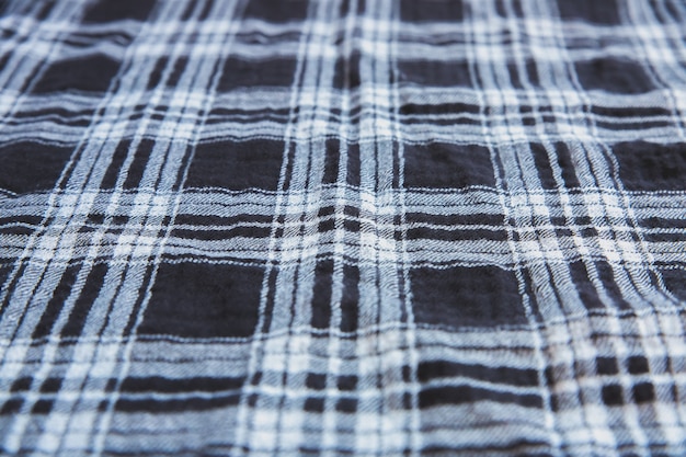 市松模様の布の質感。テキスタイルの正方形。天然素材の背景。