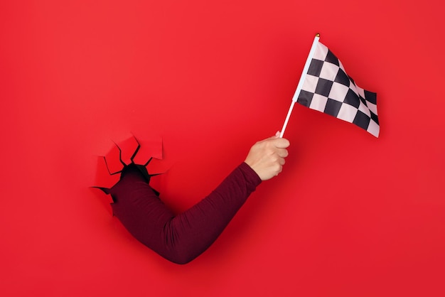 Photo checkered flag in hand