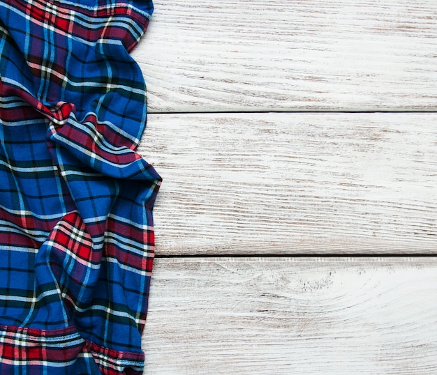 Checkered napkin on a wooden surface