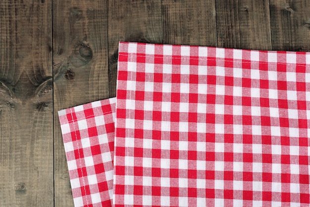 Checkered napkin on wooden table background