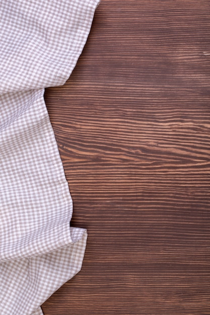 Checkered tablecloth on wooden table