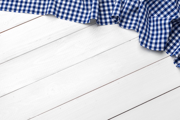 checkered tablecloth on wooden table