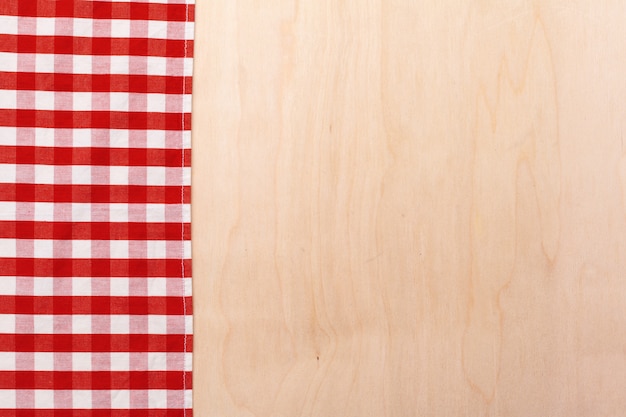 Checkered tablecloth on wooden table