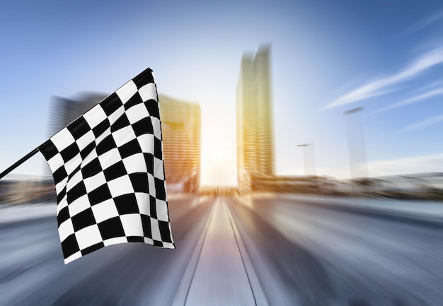 Photo checkered waving flag on city background. concept