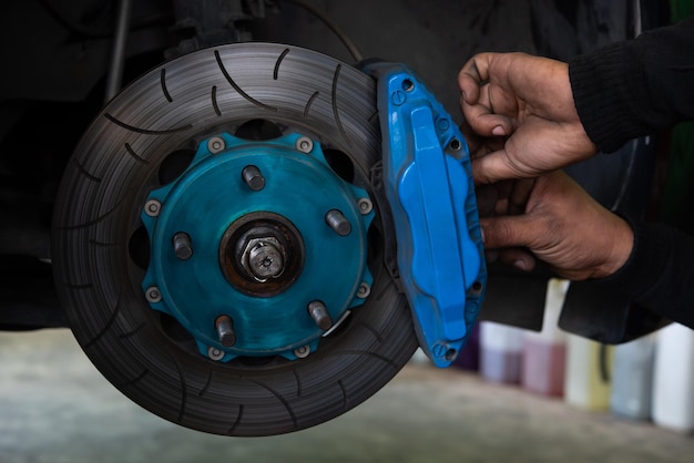 Checking car brake system for repair at car garage