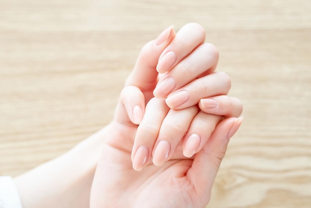 Checking the condition of her nails