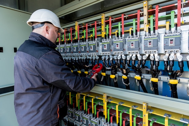 Checking the operating voltage levels of the solar panel switchgear compartment