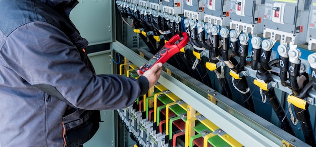 Checking the operating voltage levels of the solar panel switchgear compartment