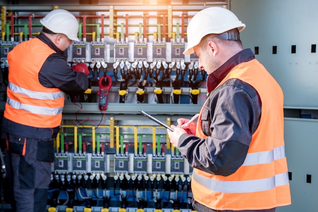 Photo checking the operating voltage levels of the solar panel switchgear compartment