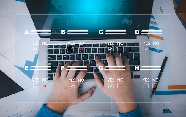 Checklist and clipboard task documentation management business people working laptop checklist questionnaire assessment form online survey online exam Choosing the right answer in the exam