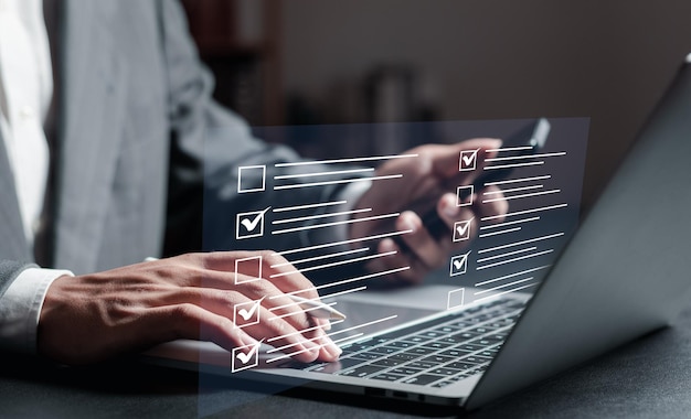 Checklist concept businessman checking mark on checklist online survey form completion Corporate