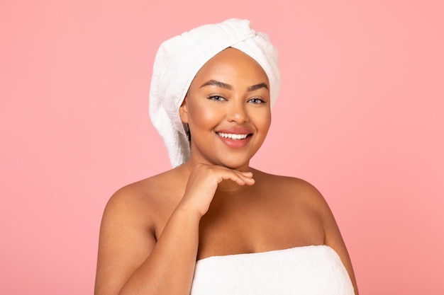 Cheerful African American Lady Posing Touching Face Over Pink Background