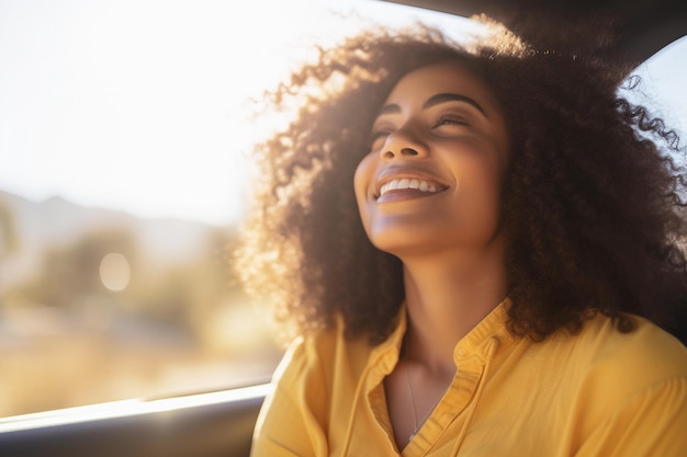 Cheerful African American woman leans out of the car window enjoying the sun