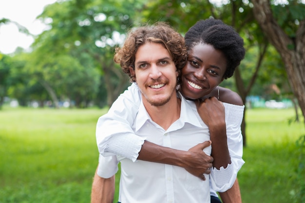 Cheerful African woman embracing her lover