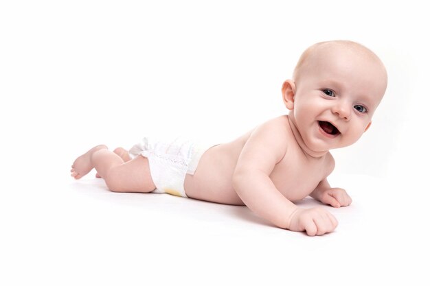 Cheerful baby in a diaper on a naked body laughs on a white isolated background