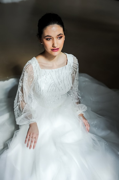 Cheerful beautiful bride in the interior