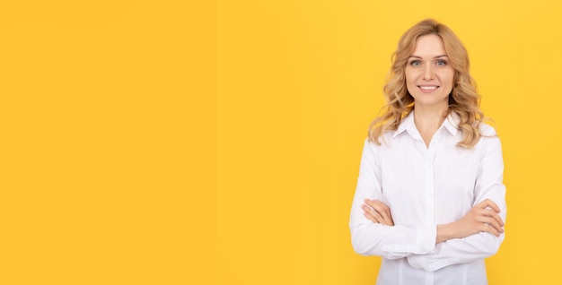 cheerful blonde woman in white shirt. office worker. corporate fashion. business casual style. girl white collar. executive assistant or employee. smiling businesswoman. female boss ceo. copy space.