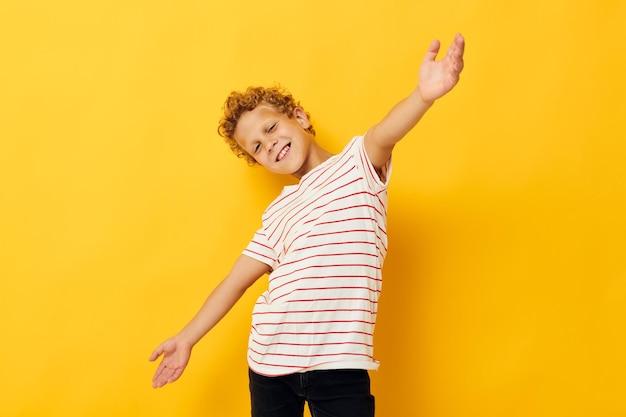 Cheerful Boy in a striped Tshirt gestures with his hands