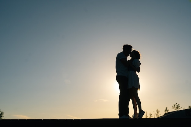 Cheerful boyfriend and girlfriend enjoying time together outdoor