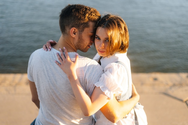 Cheerful boyfriend and girlfriend enjoying time together outdoor