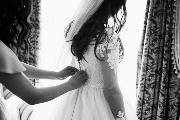 Cheerful bride and bridesmaids with bouquets