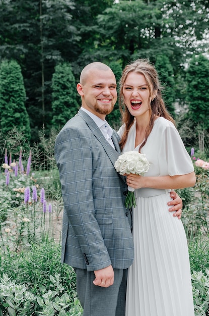 cheerful brides smile and hug