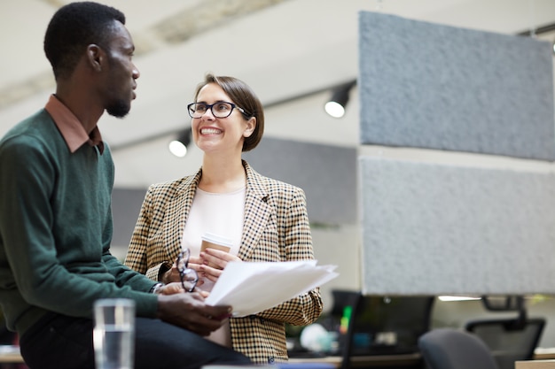 Cheerful Business Manager Talking to Intern