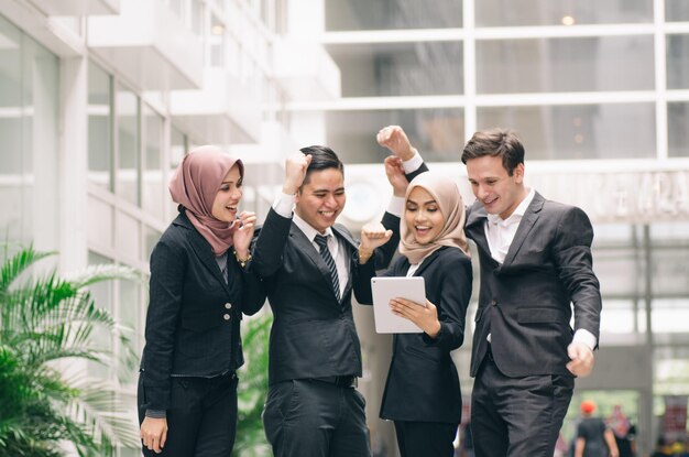 Cheerful business people standing outdoors