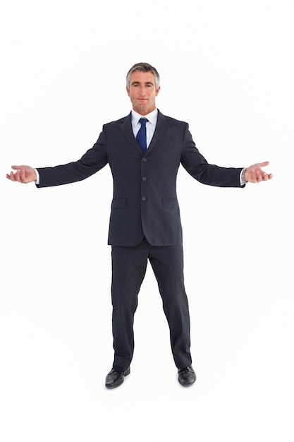 Cheerful businessman spreading his arms