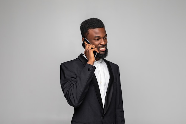 Cheerful businessman talking on mobile phone