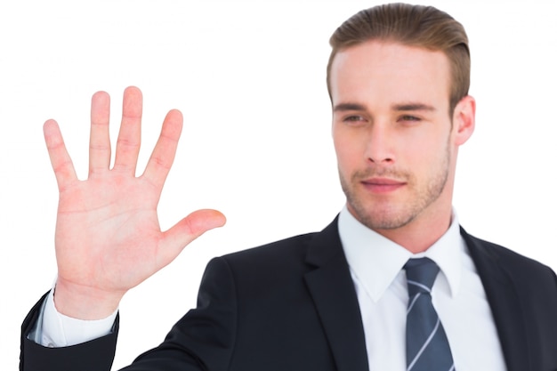 Cheerful businessman with hand raised