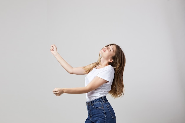 cheerful and calm girl on a white background in the studio