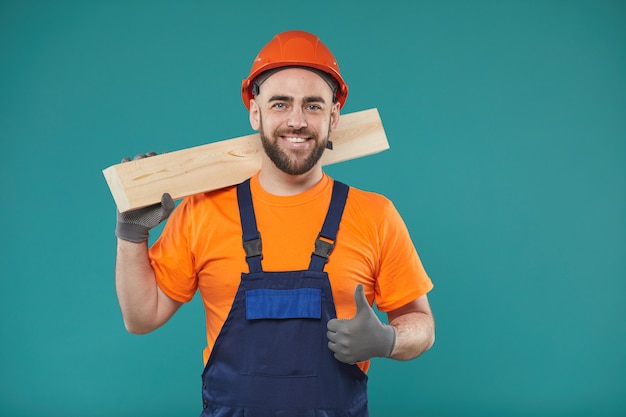 Cheerful Carpenter With Thumb Up