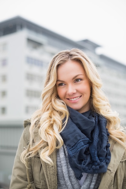 Cheerful casual blonde posing outdoors