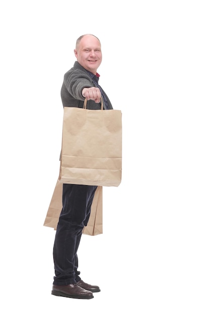 Cheerful casual man with shopping bags isolated on a white background