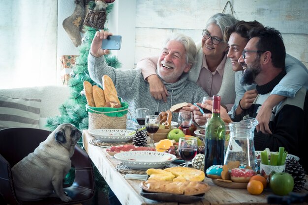 Cheerful caucasian family enjoy christmas holidays lunch at home