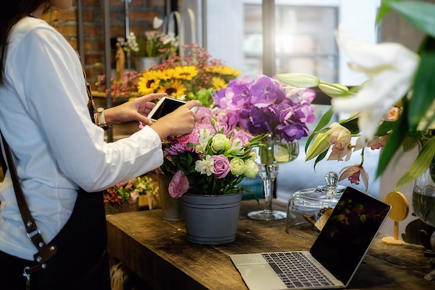 Cheerful charming young business owner flower shop 