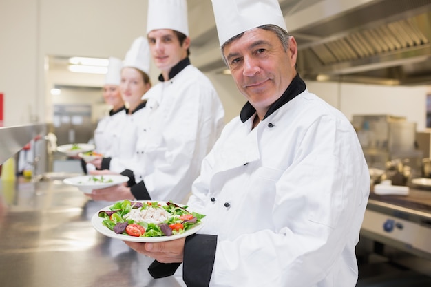 Cheerful Chefs showing their salads