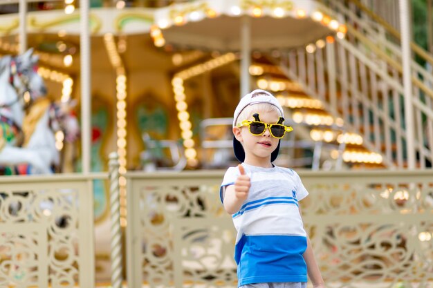 A cheerful child in an amusement park