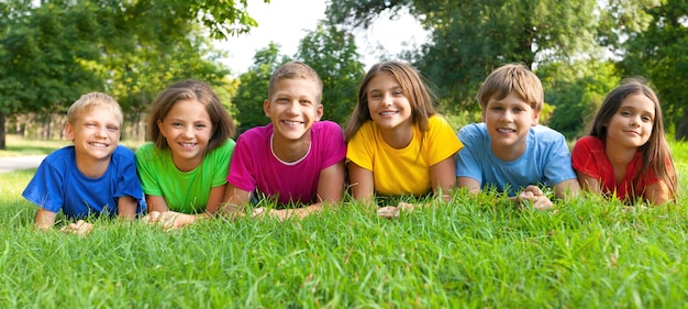 Cheerful children on green grass ,childhood  concept