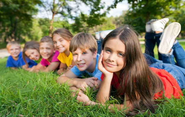 Cheerful children on green grass ,childhood  concept