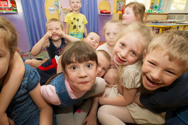 Cheerful children in kindergarten A group of sixyearold boys and girls